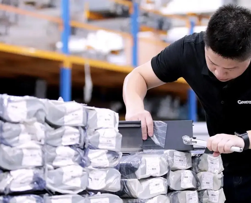 Quality inspection of aluminum pergola components by staff